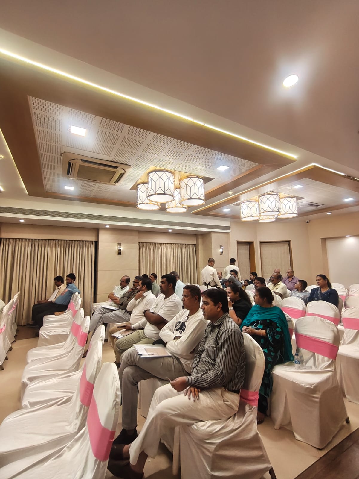 Row of members attentively following the Annual General Body Meeting discussion