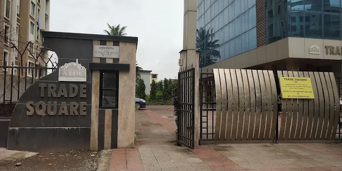 Trade Square compound entrance gate with the stone TRADE SQUARE name wall
